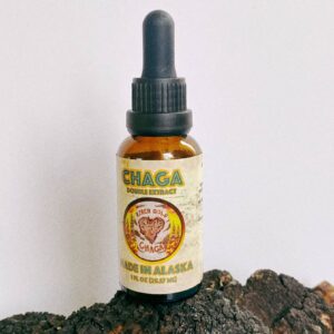 Chaga double extract sitting on a piece of chaga
